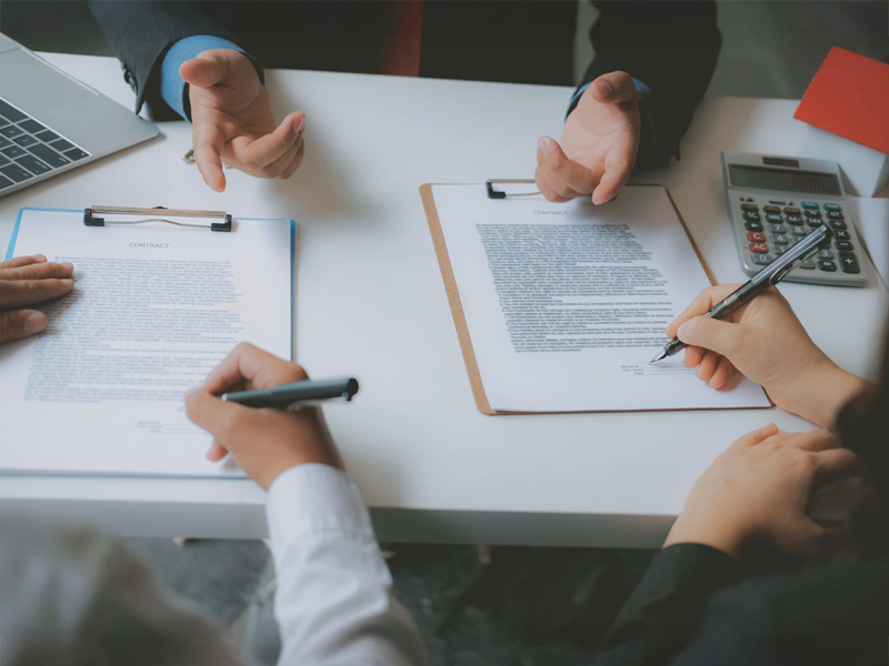 couple buying renting house signing mortgage contract agreement with realtor real estate agent
