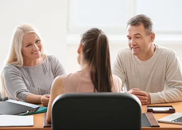 a couple speaking with a lawyer during mediation