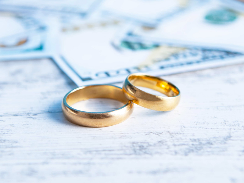 wedding rings sitting table with money