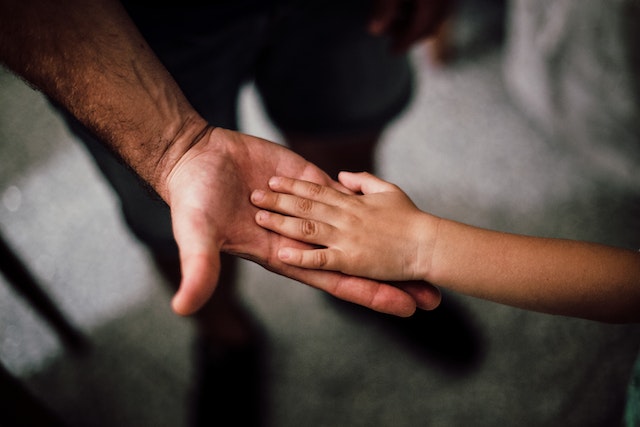 parent and child holding hands