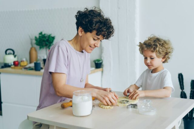 parent and child making cookies